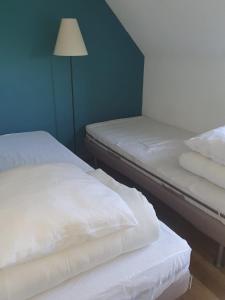 Una cama o camas en una habitación de Maison à Quiberon