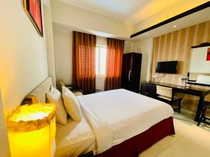 Katil atau katil-katil dalam bilik di Orchid Business Hotel