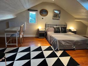 Cama ou camas em um quarto em Villa atmosphère à l'ile verte