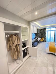 A television and/or entertainment centre at Naama Bay Suites & SPA