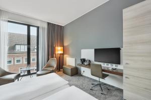 H4 Hotel Münster में टेलीविजन और/या मनोरंजन केंद्र