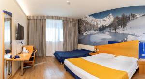 Krevet ili kreveti u jedinici u okviru objekta Hotel Express Aosta East