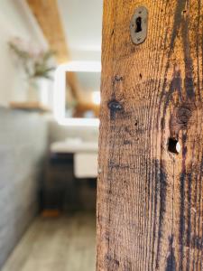 a close up of a wooden door in a room at RotmeerHaus in Feldberg