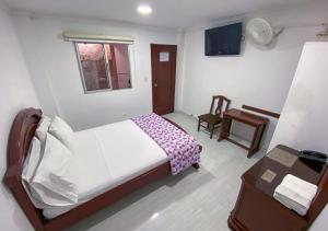 Tempat tidur dalam kamar di Hotel Exelsior