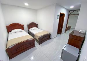 Tempat tidur dalam kamar di Hotel Exelsior