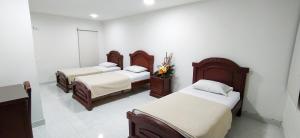 Tempat tidur dalam kamar di Hotel Exelsior