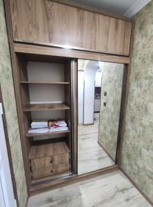 a dressing room with a mirror and a closet at gabro in Mtskheta