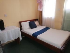 Cama ou camas em um quarto em Forest green Inn