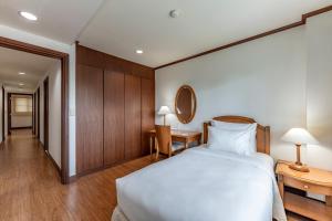 Posteľ alebo postele v izbe v ubytovaní Garden View Court Suites Ho Chi Minh City