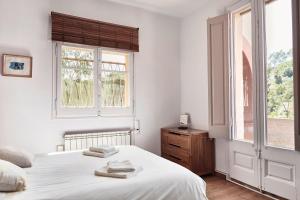 Una cama o camas en una habitación de casabelladona Barcelona