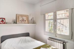 Una cama o camas en una habitación de casabelladona Barcelona