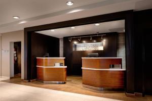 a lobby with a barber shop with wooden counters at Courtyard Novato Marin/Sonoma in Novato