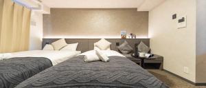 Apartment Hotel 11 Shinsaibashi II 객실 침대