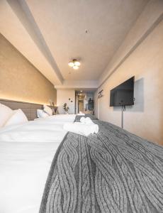 Apartment Hotel 11 Shinsaibashi II 객실 침대