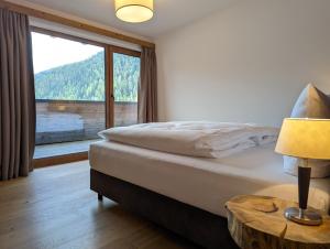 Voodi või voodid majutusasutuse ARLhome Lodge - Zuhause am Arlberg toas