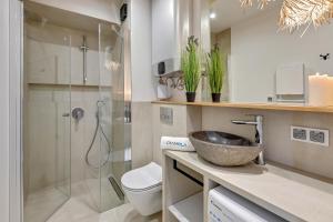 Ванная комната в STEGNA PARK B Apartamenty PIAMOLA