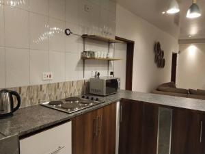 Dapur atau dapur kecil di Kasuba Apartments