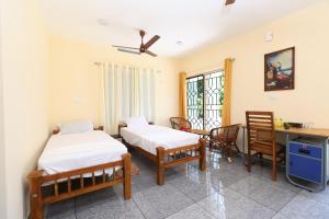 Krevet ili kreveti u jedinici u objektu GREENVIEW HOMESTAY KOVALAM