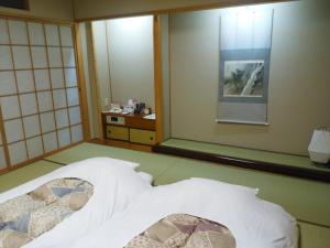 Posteľ alebo postele v izbe v ubytovaní JR Hotel Clement Tokushima