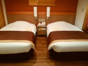 Posteľ alebo postele v izbe v ubytovaní JR Hotel Clement Tokushima