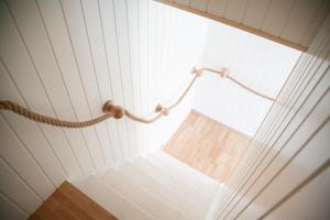 a view from the bottom of a ceiling with ropes at Pervalkos vetrunges in Neringa