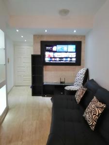 TV in/ali zabaviščno središče v nastanitvi Apartamento Deluxe Isla Margarita - Costa Azul