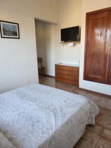 A bed or beds in a room at Apartamento con Terraza y Parrillero