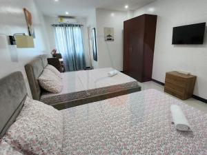 Vuode tai vuoteita majoituspaikassa RiCres Hometel Double Bed R124