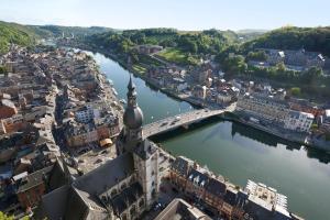 an aerial view of a city with a river at ibis Dinant Centre in Dinant