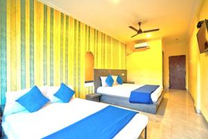 Krevet ili kreveti u jedinici u okviru objekta Swastic Hotel at Calangute GOA