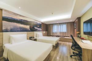 Krevet ili kreveti u jedinici u okviru objekta Atour Music Hotel Hangzhou West Lake