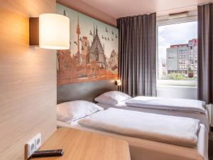 เตียงในห้องที่ B&B Hotel Nürnberg-Hbf