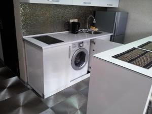 A kitchen or kitchenette at Sebi Apartment Batumi Towers