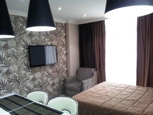 A bed or beds in a room at Sebi Apartment Batumi Towers