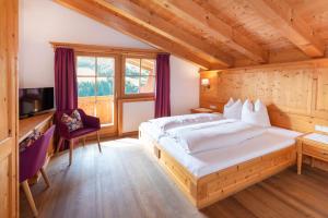 Tempat tidur dalam kamar di Gästehaus Larch