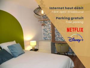 En tv och/eller ett underhållningssystem på Les Chambres de Troyes - Parking Free Fibre Netflix