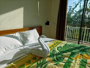 Cama ou camas em um quarto em Jukung Dive Resort Bali PENIDA