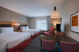 Krevet ili kreveti u jedinici u objektu TownePlace Suites by Marriott Dallas DFW Airport North/Irving