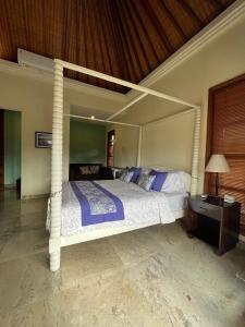 A bed or beds in a room at Villa Gekyu