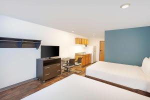 A bed or beds in a room at Extended Stay America Select Suites - Las Cruces