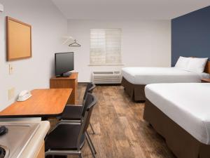 A bed or beds in a room at Extended Stay America Select Suites - Las Cruces