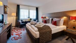 Кровать или кровати в номере Park Plaza Trier