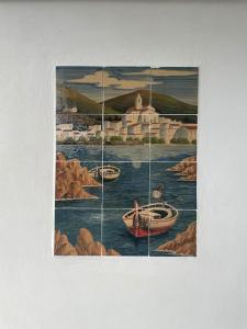 a painting of a painting of a town on the water at Can Estrellas, appartement d'exception sur la mer in Roses