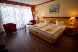 Un pat sau paturi într-o cameră la Hotel Esplanade & Aparthotel Rialto