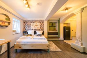 a bedroom with a bed in a room at Design Apartments - "Remise Blumberg" in Potsdam