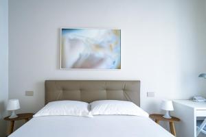 Giường trong phòng chung tại Pisa Art Apartment