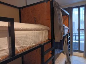 Cama ou camas em um quarto em 薇薇青旅-嚞驫驛站