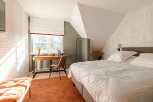 Cama ou camas em um quarto em Villa Monceau Louvain la neuve