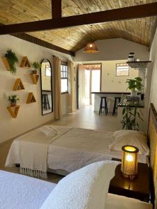 A bed or beds in a room at Villa Tiê Paraty