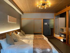 Кровать или кровати в номере Towadakohan Sakura - Vacation STAY 80357v